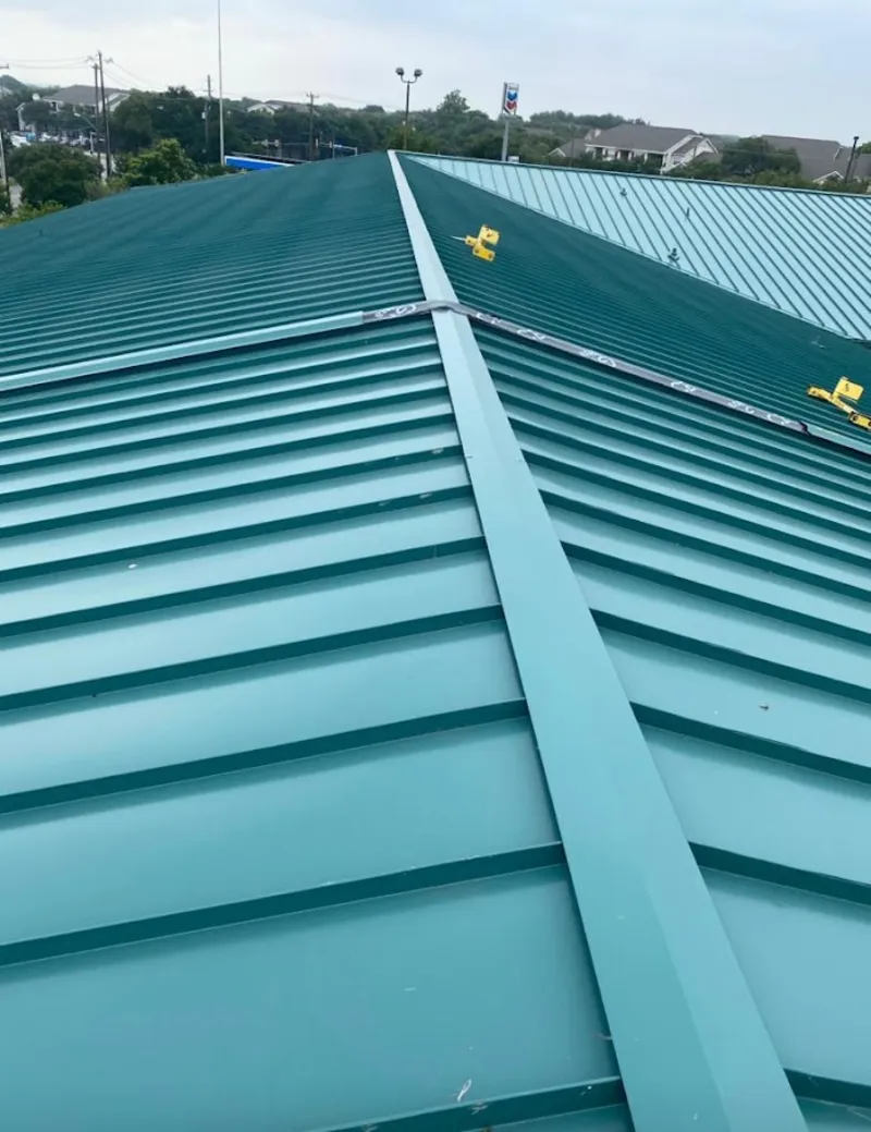 Green commercial metal roof ridge and valley for Metal Roof Repair in Blackwell